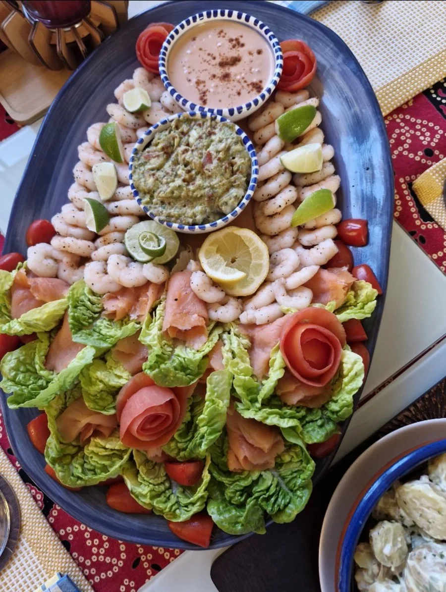 A seafood and salad platter from the Asombo Foods catering gallery